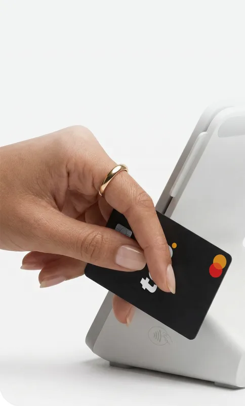 Person paying with Tap at a store worldwide